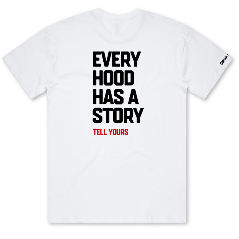A white short-sleeve t-shirt with bold black text reading 'EVERY HOOD HAS A STORY' and smaller red text reading 'TELL YOURS' on the front. A small black 'DKNY' logo is visible on the left sleeve.
